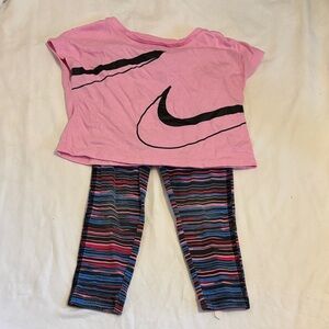 Nike Pink Crop Top with Black Swoosh and Striped Leggings